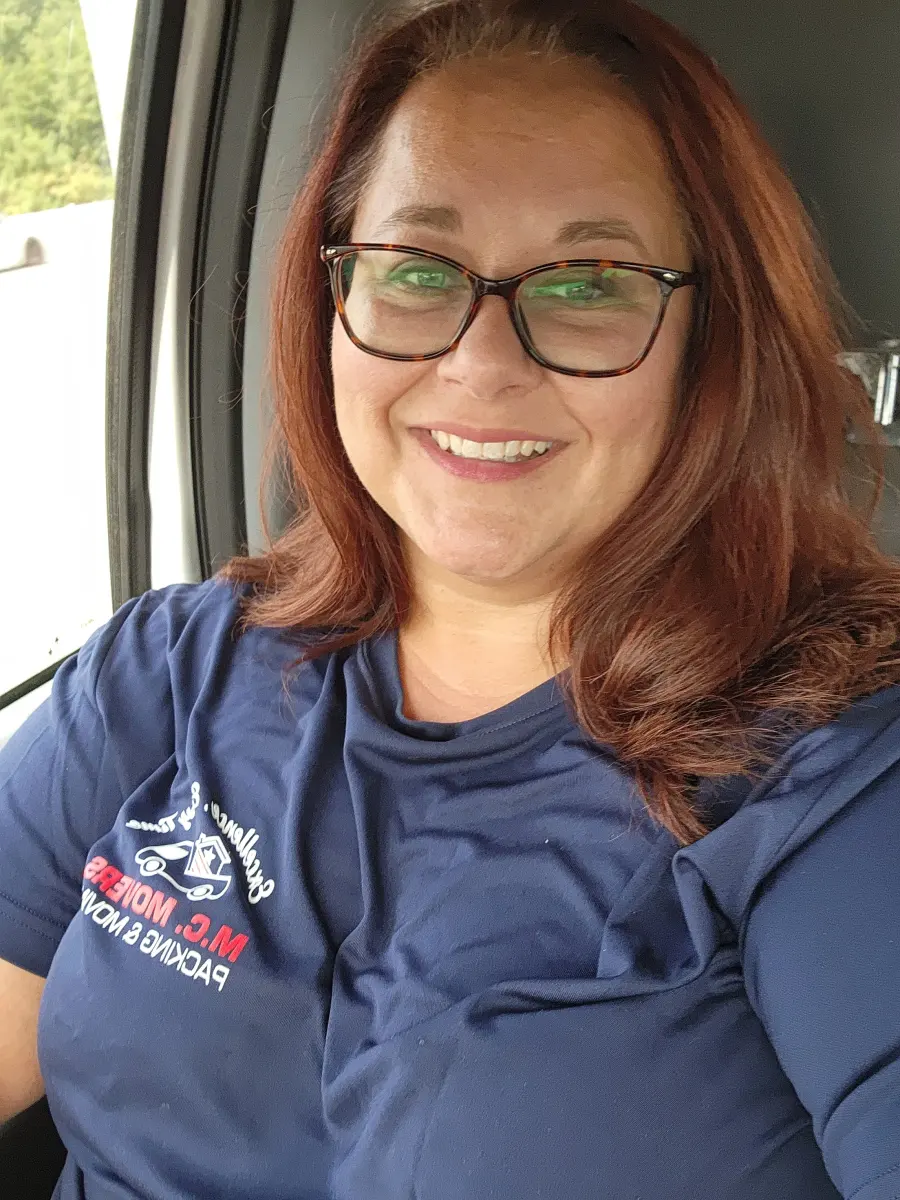 M.C. Movers team member in a company shirt